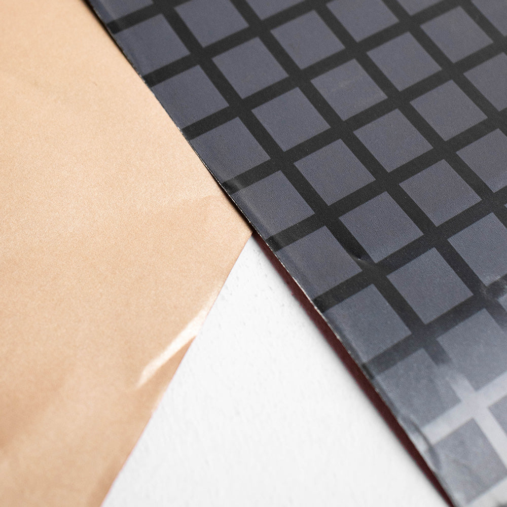 Inpakpapier zwarte blokjes 50cm x 200mtr